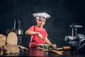 Portrait of cute little chef with vegetable dish Royalty Free Stock Photo