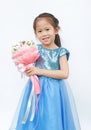 Portrait of a cute little child girl with Bouquet of roses isolated on white background Royalty Free Stock Photo