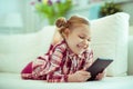 Portrait of cute little child girl with tablet at digital homeschooling Royalty Free Stock Photo