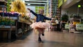 Portrait of cute little dancing girl in supermarket Royalty Free Stock Photo