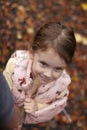 Portrait of a cute little girl in autumn park. Selective focus Royalty Free Stock Photo