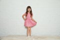 Portrait of cute little girl brick wall Royalty Free Stock Photo