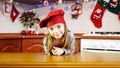 Portrait of cute little girl chef in the christmas kitchen Royalty Free Stock Photo