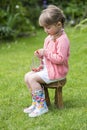 Portrait of a cute little girl eating strawberries Royalty Free Stock Photo