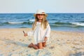 Portrait of a cute little girl in a hat on the beach Royalty Free Stock Photo