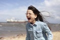 Portrait of a cute little girl having fun on the beach Royalty Free Stock Photo
