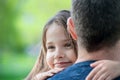 Portrait of cute little girl held in father arms. Happy loving family. Father and his daughter child girl playing hugging. Cute Royalty Free Stock Photo