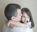 Portrait of cute little girl held in father`s arms. Happy loving family. Father and his daughter child girl playing hugging Royalty Free Stock Photo