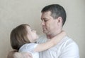 Portrait of cute little girl held in father`s arms. Happy loving family. Father and his daughter child girl playing hugging Royalty Free Stock Photo