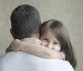 Portrait of cute little girl held in father`s arms. Happy loving family. Father and his daughter child girl playing hugging Royalty Free Stock Photo