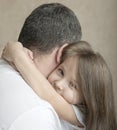 Portrait of cute little girl held in father`s arms. Happy loving family. Father and his daughter child girl playing hugging Royalty Free Stock Photo