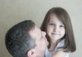 Portrait of cute little girl held in father`s arms. Happy loving family. Father and his daughter child girl playing hugging Royalty Free Stock Photo