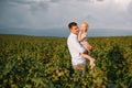 Portrait of cute little girl held in father`s arms. Happy loving family. Father and his daughter child girl playing hugging. Cute Royalty Free Stock Photo