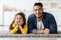 Cute Little Girl And Her Handsome Young Arab Father Relaxing At Home Royalty Free Stock Photo