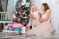 Portrait of cute little girl and his morther  in the same festive dress  in a festive New Year`s atmosphere Royalty Free Stock Photo