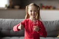 Cute Little Girl Holding Glass Of Water And Showing Thumb Up Royalty Free Stock Photo