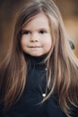 Portrait of cute little girl with long hair and hazel eyes medium close up Royalty Free Stock Photo