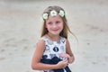 Portrait cute little girl with long hair and a wreath of flowers. Royalty Free Stock Photo