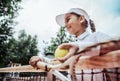 portrait of cute happy little girl playing tennis in summer Royalty Free Stock Photo