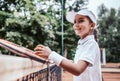 portrait of cute little girl playing tennis in summer Royalty Free Stock Photo