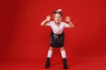 Portrait of a cute little girl in a white T-shirt and black skirt on a red background. Royalty Free Stock Photo