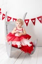 Portrait of a cute little girl in a red skirt Royalty Free Stock Photo