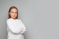 Portrait of cute little girl smiling brightfully wearing white t-shirt on white studio wall banner background Royalty Free Stock Photo