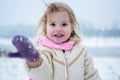 Portrait of cute little girl on snowy winter day. Royalty Free Stock Photo