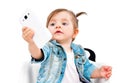 Portrait of cute little girl, taking selfie on mobile phone Royalty Free Stock Photo