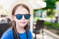 Portrait of a cute little girl wearing hat and sunglasses Royalty Free Stock Photo