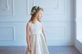 Portrait of a cute little girl in wreath of flowers Royalty Free Stock Photo