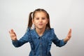 Portrait of cute little smiling girl with raised hands Royalty Free Stock Photo