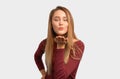 Portrait of cute lovely girl sending blowing kiss with pout lips looking at camera Royalty Free Stock Photo