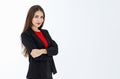 Portrait of cute mature businesswoman wearing black suit posing in professional confident with arms crossed, studio shot isolated Royalty Free Stock Photo