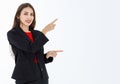 Portrait of cute mature businesswoman wearing black suit in professional confident pointing finger to blank space in advertising Royalty Free Stock Photo