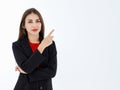 Portrait of cute mature businesswoman wearing black suit in professional confident pointing finger to blank space in advertising Royalty Free Stock Photo