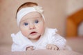 Portrait of a cute 3 month old baby lying on a blanket Royalty Free Stock Photo