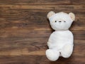 Portrait of cute mummy teddy bear doll bind with white gauze or bandage on dark wooden background Royalty Free Stock Photo