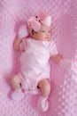 Portrait of a cute newborn baby girl in pink dress Royalty Free Stock Photo