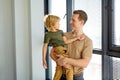 Portrait of cute parent dad and son feeling love, man holding child boy in hands Royalty Free Stock Photo