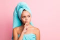 Portrait of cute ponder girl wear turquoise bath clothes look empty space isolated on pastel pink color background Royalty Free Stock Photo