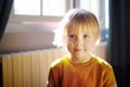 Portrait of a cute preschooler boy on a sunny morning at home Royalty Free Stock Photo