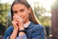 Portrait of cute casual girl charmingly looking in camera outdoor Royalty Free Stock Photo