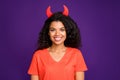 Portrait of cute pretty nice charming devil smiling toothily staring at you with red horns out of her head isolated Royalty Free Stock Photo