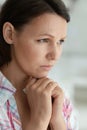 Portrait of cute sad young woman posing at home Royalty Free Stock Photo