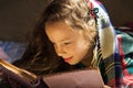 portrait of cute school girl reading an old book at cold day Royalty Free Stock Photo