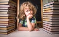 Portrait of cute schoolgirl thinking while sitting