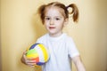 Portrait of cute smiling girl with ball Royalty Free Stock Photo