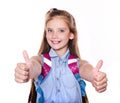 Portrait of cute smiling happy little school girl child teenager with two fingers up and backpack Royalty Free Stock Photo