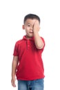 Portrait of cute smiling little boy closed one eye with his hand Royalty Free Stock Photo